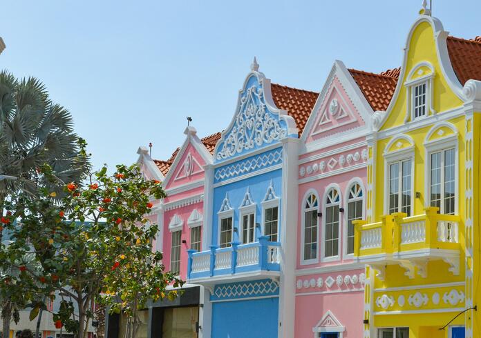 A row of brightly colored houses on a street in&nbsp;Oranjestad, Aruba.