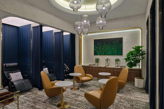 The LAX Delta One Lounge wellness room features eight private relaxation pods equipped with zero-gravity chairs and full-body massage chairs.&nbsp; 