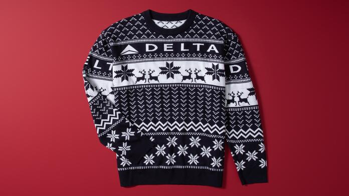 Show off your love for travel this winter with our Navy Delta Holiday Sweater. Cozy and colorful, this sweater is perfect for any festive occasion. 