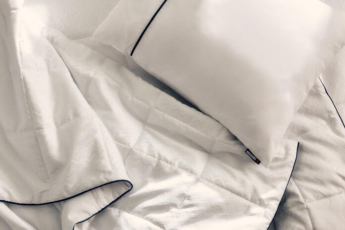 The new Delta One bedding set will include the Missoni duvet and white sleeping pillow, which feature a subtle and elegant Missoni zigzag design and navy accents. 