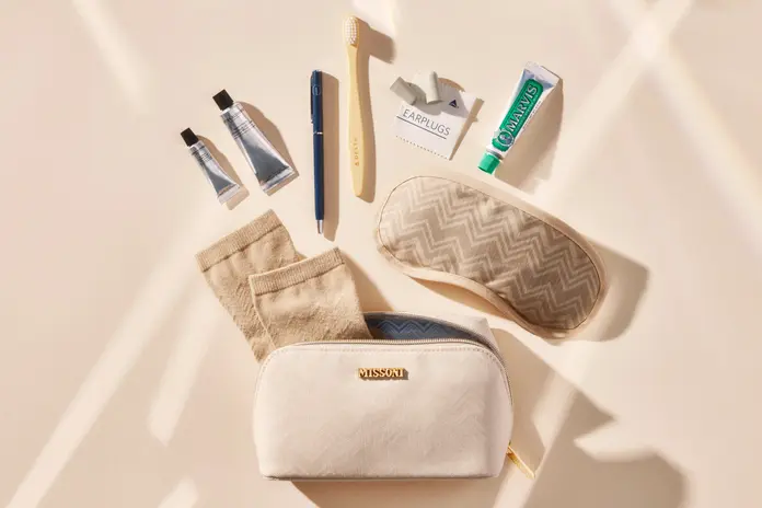 A shot featuring the new Delta One x Missoni amenity kit and the products featured inside the kit, which includes Missoni socks, Grown Alchemist skincare and more.