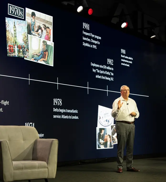 Man giving presentation on stage