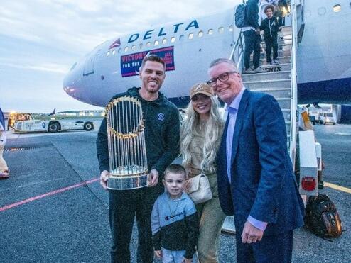 Ed poses with Freddie Freeman and his family.