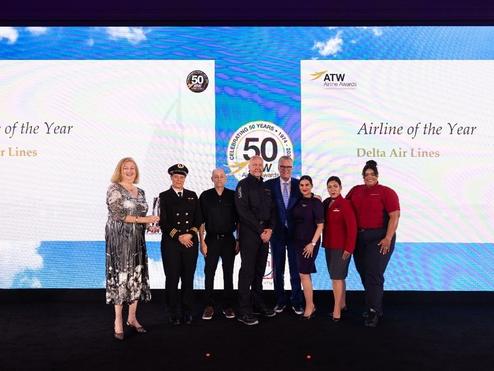 Delta CEO Ed Bastian was joined onstage by six uniformed employees to accept the ATW Airline of the Year Award and Hall of Fame Honor in Dubai on Friday, May 31.