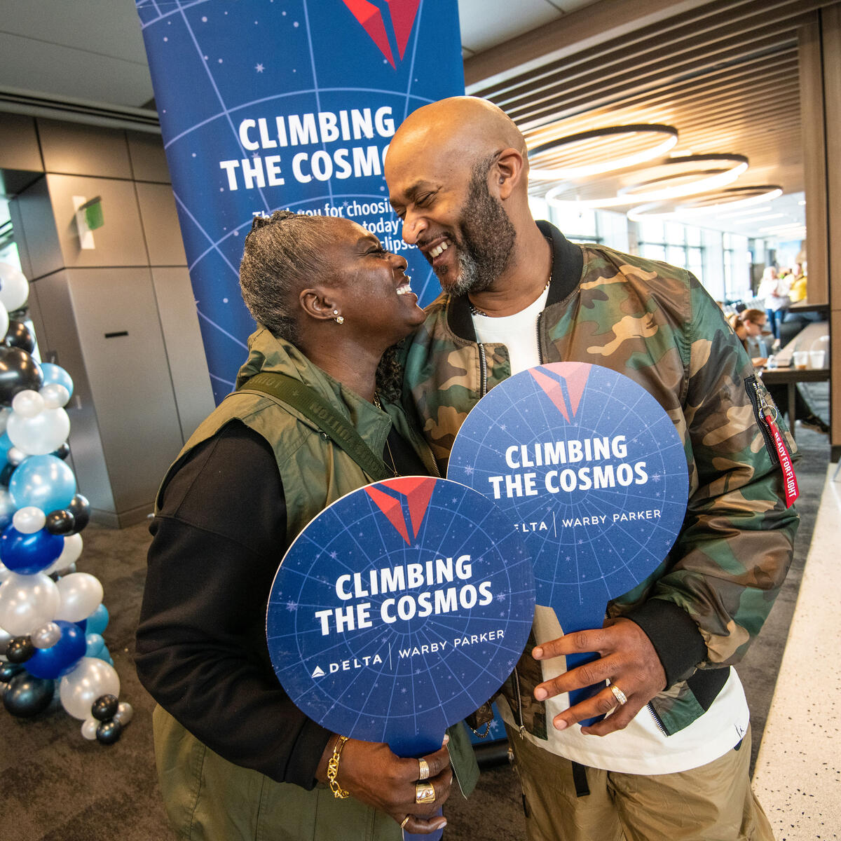 A Delta employee and her husband enjoy the festivities in AUS ahead of one of Delta's two eclipse flights on April 8, 2024.