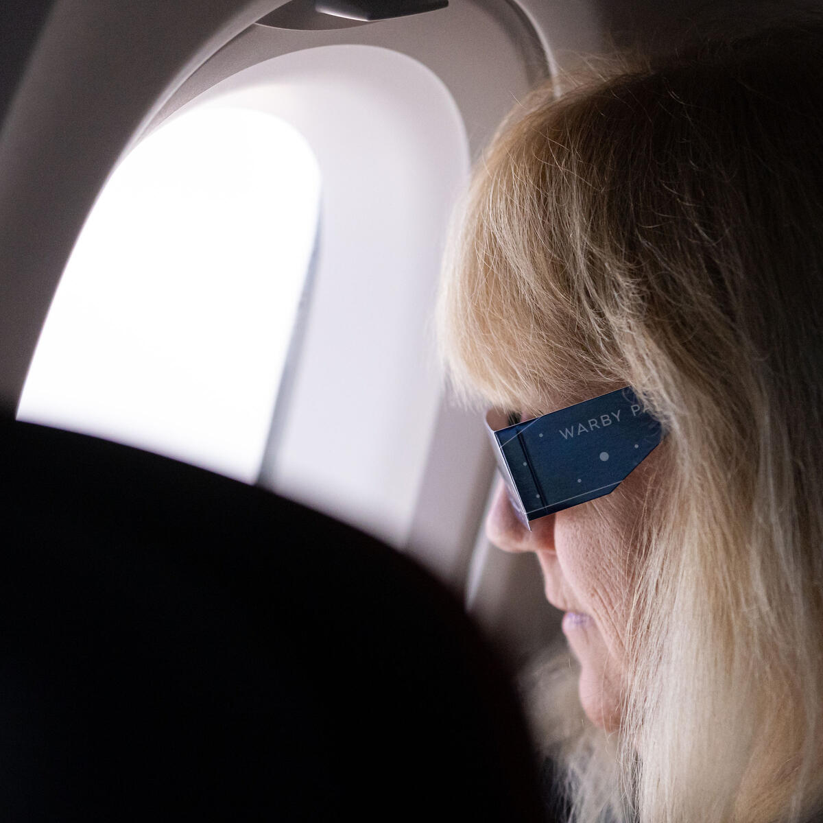 Customers on board DL 1010 from Dallas Fort Worth International Airport (DTW) to Detroit Wayne County Metropolitan Airport (DFW) view the solar eclipse.