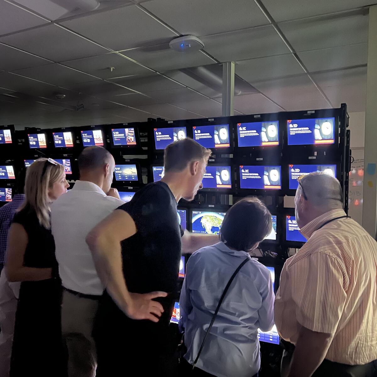 Members of the Advisory Board on Disability test Delta's new flight map in the In-Flight Entertainment lab.