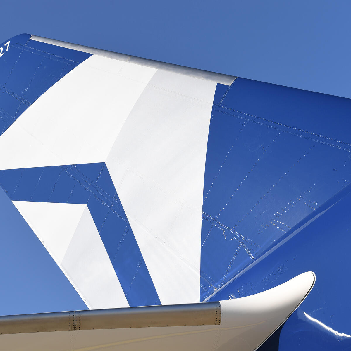 The tail of Delta's Centennial livery, which features the airline's Centennial colors: blue and silver.