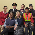 Delta people from across the airline's business pose in this 2024 photo.