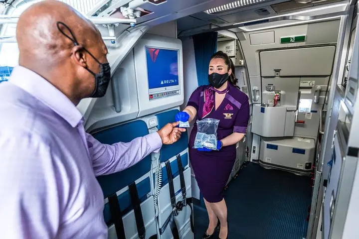 Delta hand sanitzer while boarding
