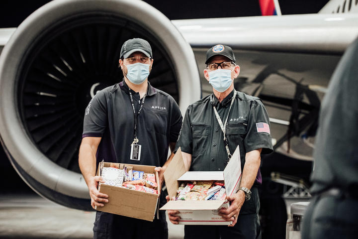 TechOps employee and veteran ships out 7,000th care package to military