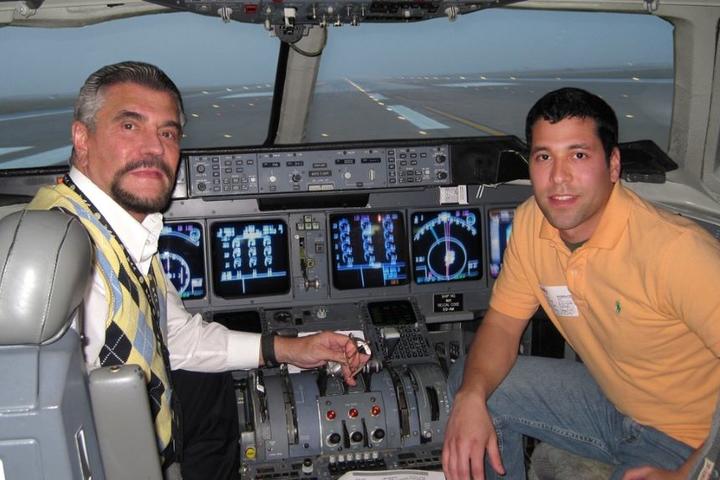 Mike Farinas and his father in the simulator together, pre-pandemic.