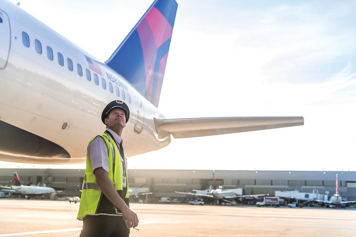 A pilot inspects a 757