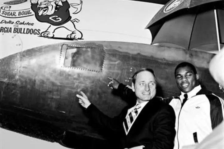 Georgia coach Vince Dooley with Herschel Walker