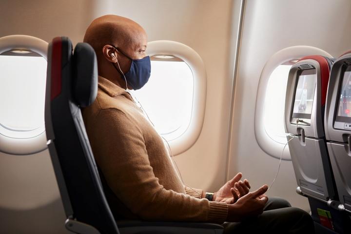 A customer enjoys some of Delta's in-flight wellness offerings.