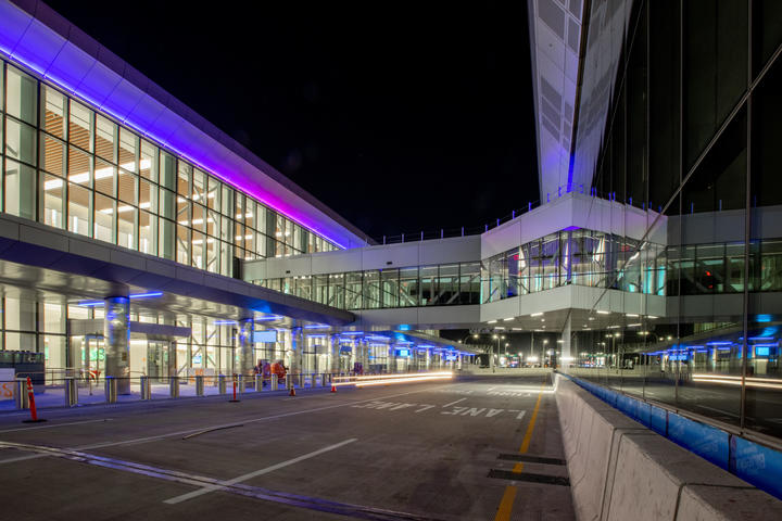 Night exterior view of Delta's LGA terminal