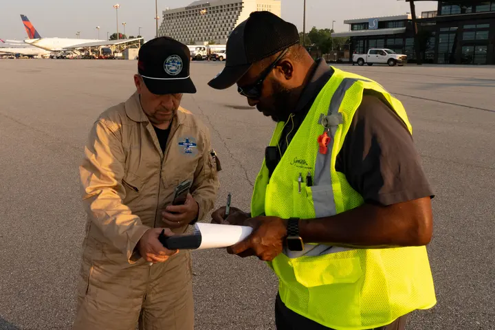 Pilots Barry Behnfeldt and Aaron Wilson, along with maintenance technician Thomas Twiddy make a stop at Hartsfield-Jackson Atlanta International Airport (ATL) during their 48N48 mission -- an attempt to land in all 48 of the contiguous states within 48 hours. They were greeted by Delta Chief of Operations John Laughter.