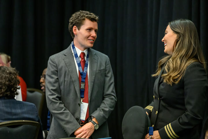 Delta employee Michael Hulse speaks with Samantha Warren, a Delta pilot and the very first Propel Company graduate.