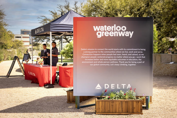 Delta Air Lines signage welcomes visitors to the pop-up market and mural unveiling event, in partnership with Future Front Texas and Waterloo Greenway on&nbsp;Sunday, March 10, at Meredith Heritage Tree Deck in Waterloo Park.