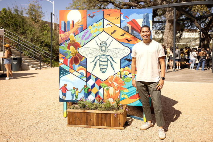 Ruben Esquivel of&nbsp;East End Eclectic&nbsp;stands next to a mural he co-designed with Kat Talley and Delta Air Lines. The mural will be utilized as part of Waterloo Greenway's annual Artist in Residence program with East End Eclectic through the summer and highlighted during spring and summer as part of Waterloo Greenway’s environmental and art programs.&nbsp;