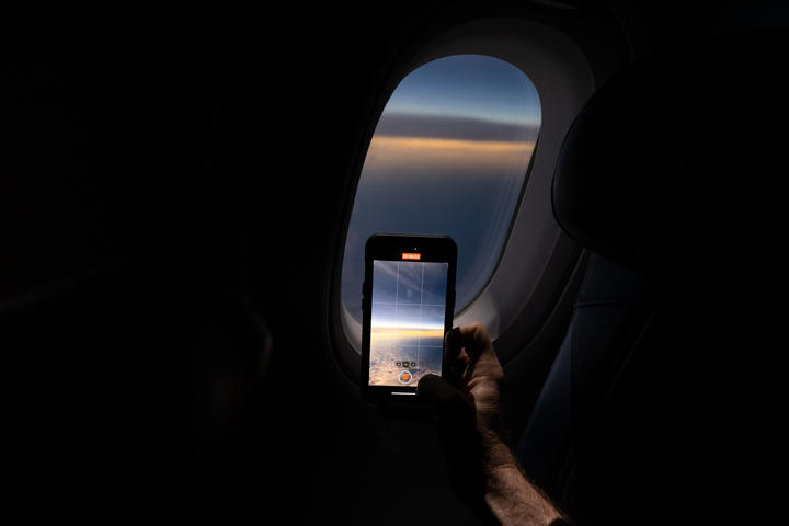 Customers on board DL 1010 from Dallas Fort Worth International Airport (DTW) to Detroit Wayne County Metropolitan Airport (DFW) view the solar eclipse.