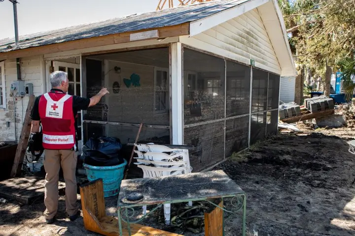 An American Red Cross volunteer aids the needs of others in the wake of Hurricane Helene.