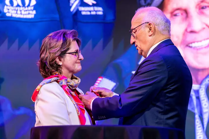 Ambassador of France Philippe Étienne presents French Legion of Honor to Virginie Durr.