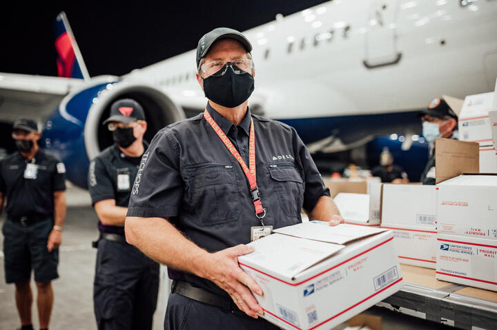 TechOps employee and veteran ships out 7,000th care package to military 