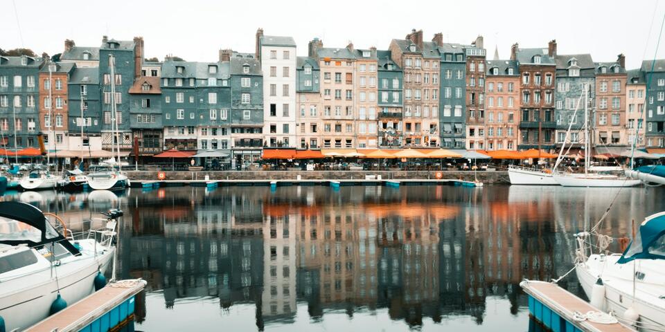 Colorful half-timbered houses line the picturesque harbor in Honfleur.