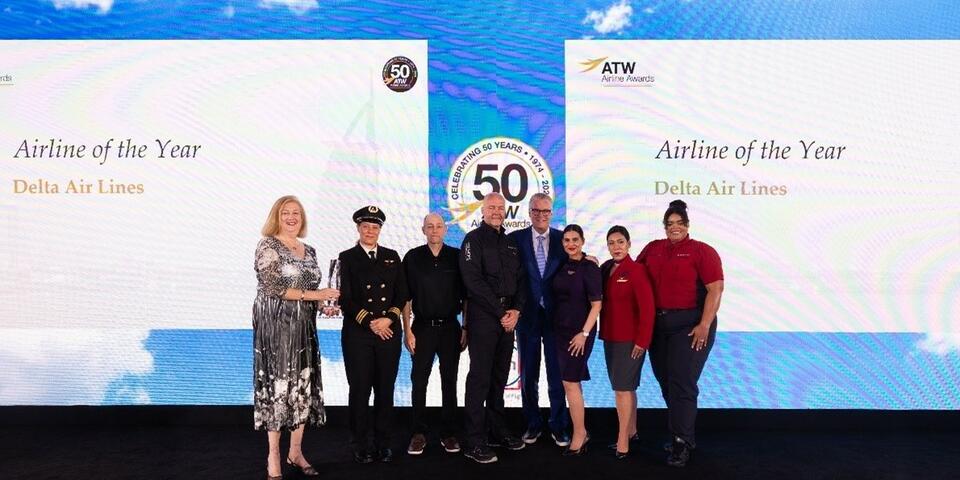 Delta CEO Ed Bastian was joined onstage by six uniformed employees to accept the ATW Airline of the Year Award and Hall of Fame Honor in Dubai on Friday, May 31.