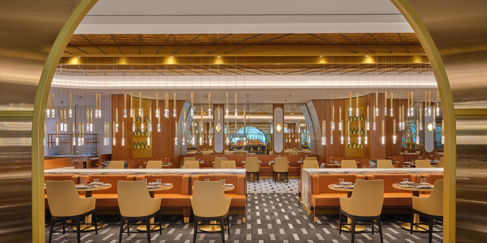 The iconic overlapping strands of the Brooklyn Bridge provided inspiration for the suspended lighting fixture in the dining room at The Delta Lounge-JFK.