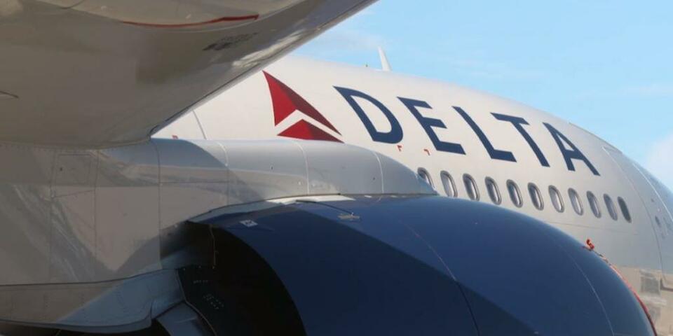Side view of Delta A330-900 aircraft displaying Delta logo.