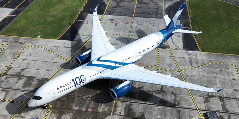 A drone view of Delta's Centennial livery, which features swooping designs and a bold 100 emblem.