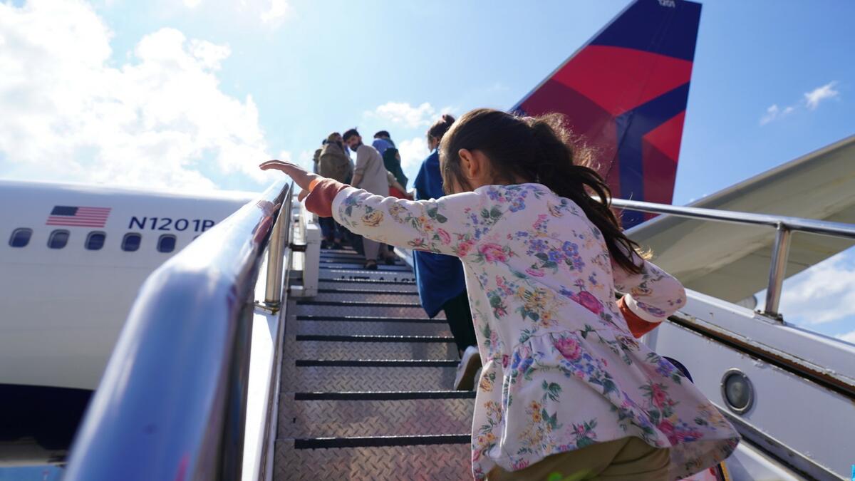 Evacuees from Afghanistan board at Ramstein air base.