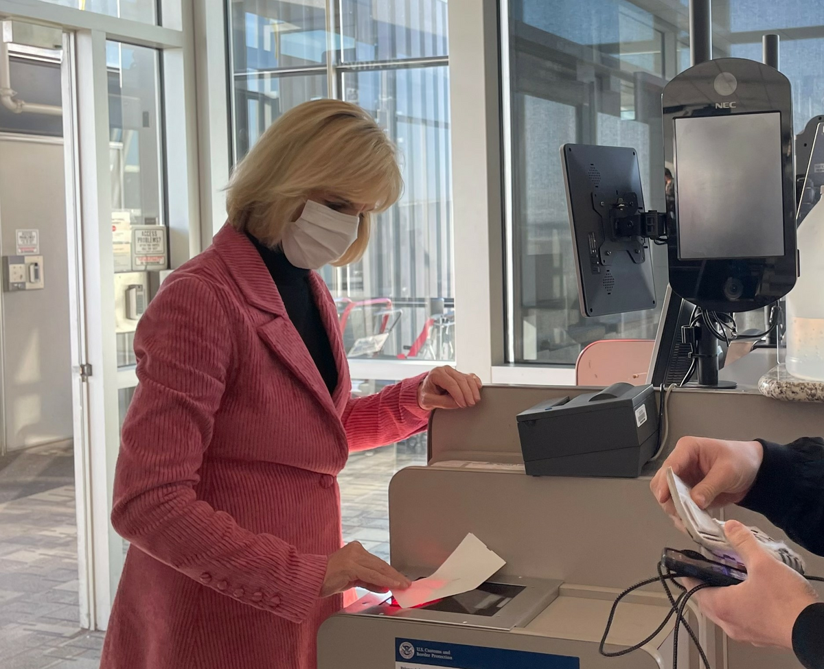 E.V.P. and Chief Customer Experience Officer Allison Ausband spends time scanning boarding passes at Delta's MSP hub.