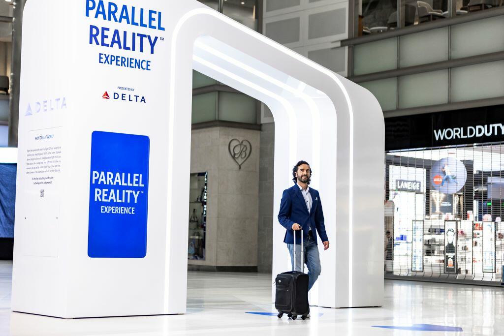 Delta customer entering the new PARALLEL REALITY experience at DTW.