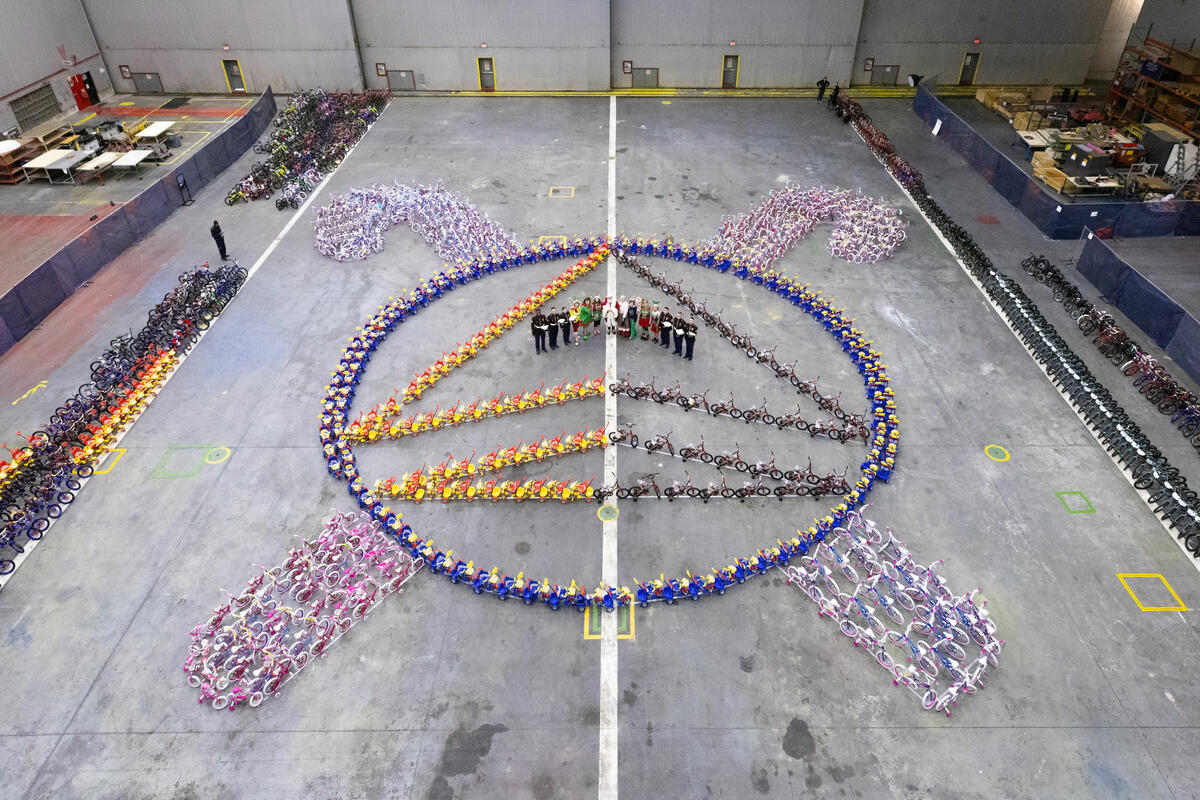Leading up to the Delta TechOps Toys for Tots event, pink and blue bikes lined the halls of the TechOps facility and bikes were assembled in the shape of the Delta Widget with candy canes around it.