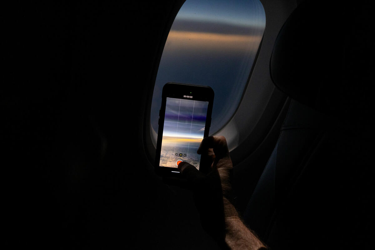 Customers on board DL 1010 from Dallas Fort Worth International Airport (DTW) to Detroit Wayne County Metropolitan Airport (DFW) view the solar eclipse.