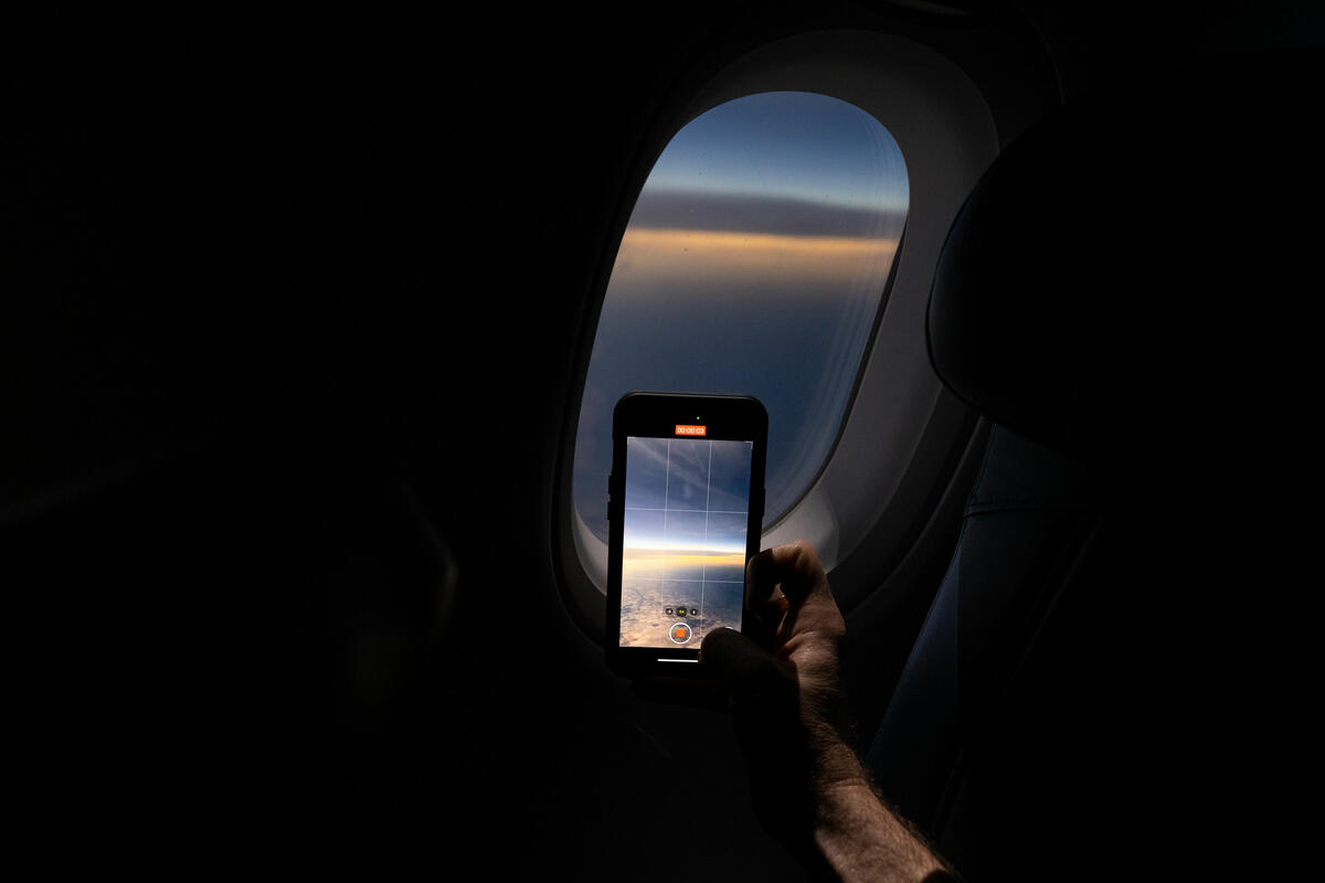Customers on board DL 1010 from Dallas Fort Worth International Airport (DTW) to Detroit Wayne County Metropolitan Airport (DFW) view the solar eclipse.