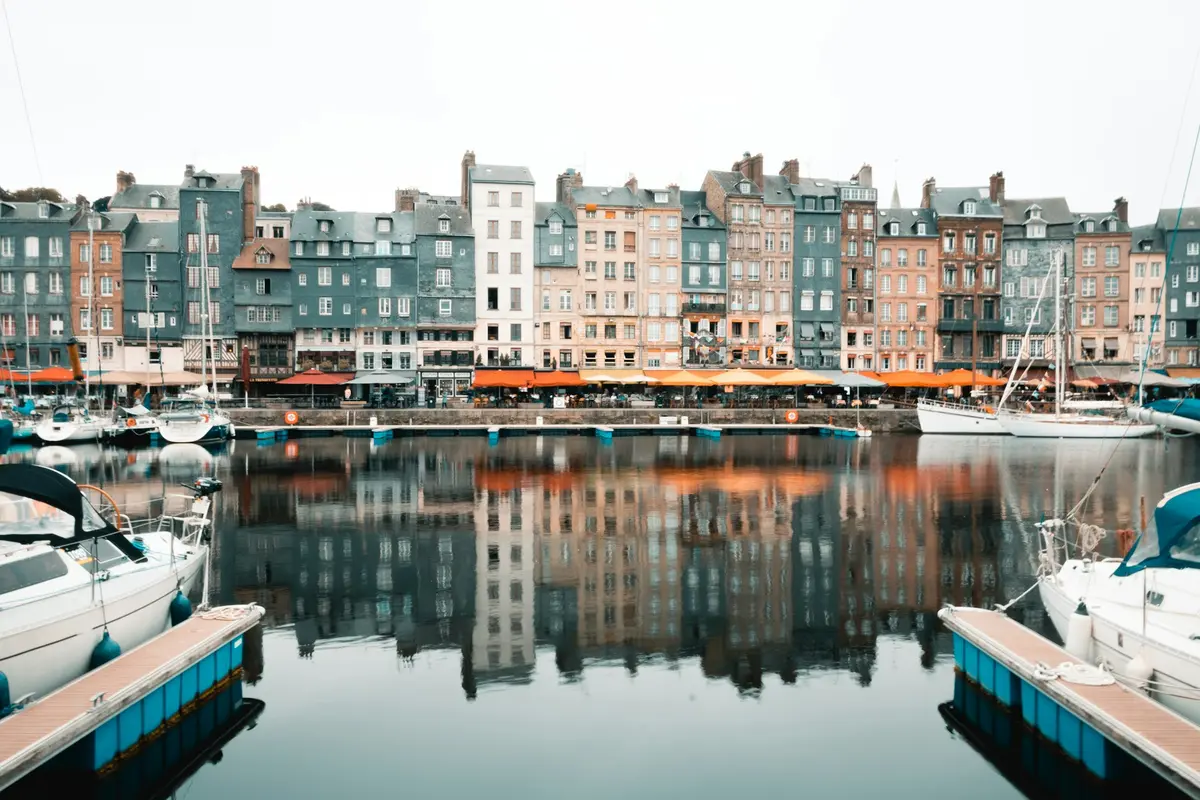 Colorful half-timbered houses line the picturesque harbor in Honfleur.