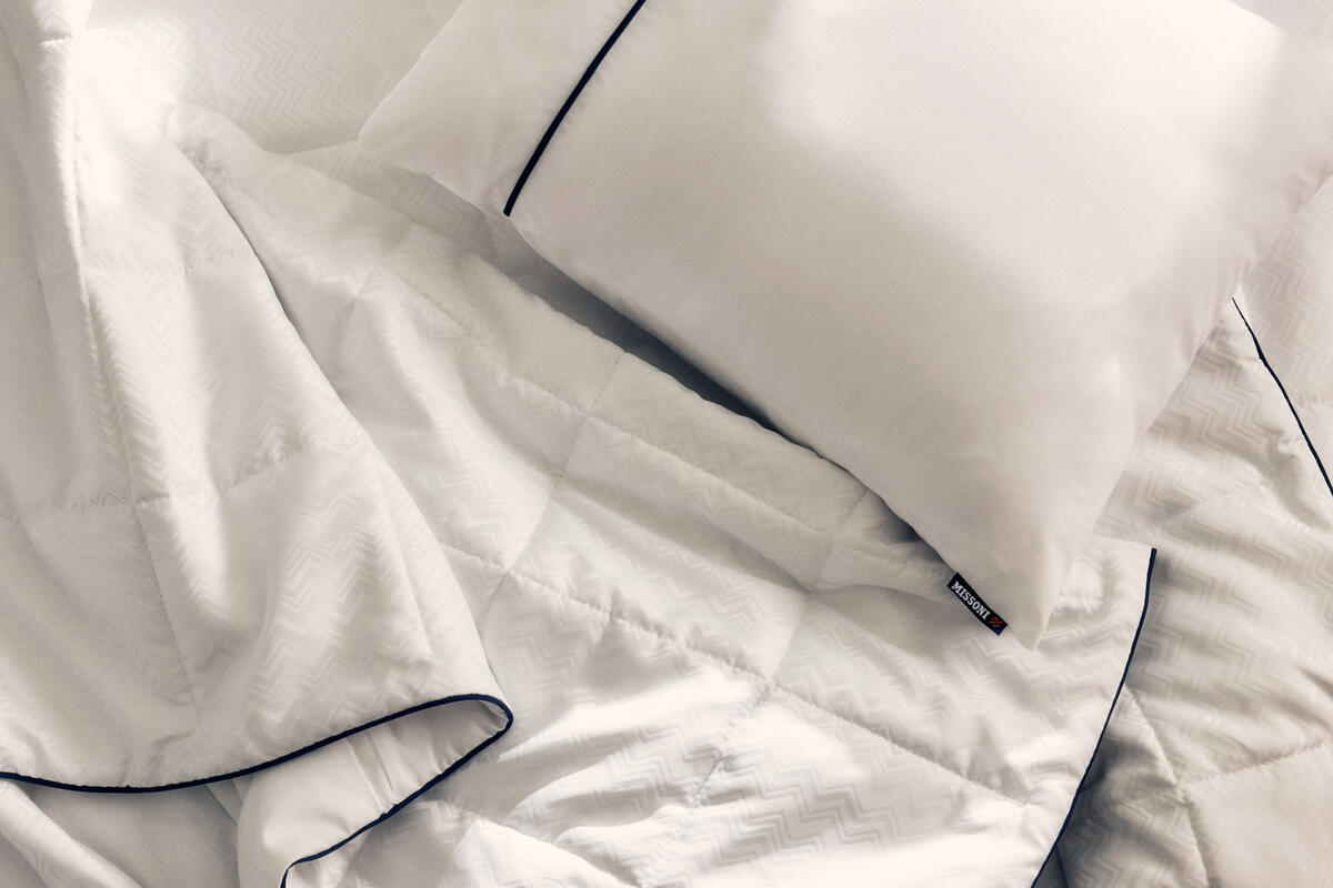 The new Delta One bedding set will include the Missoni duvet and white sleeping pillow, which feature a subtle and elegant Missoni zigzag design and navy accents. 