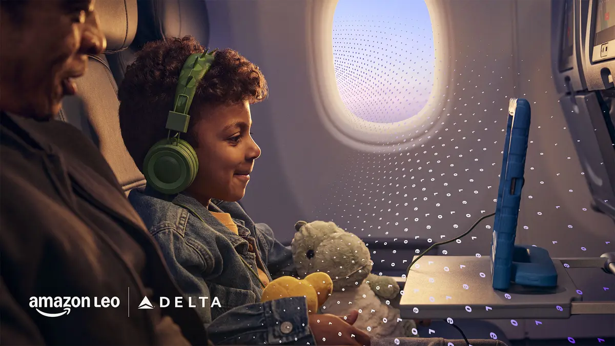  A child seated on an airplane uses a tablet while wearing headphones and holding a stuffed toy, with another seated adult and an airplane window visible, overlaid with a subtle digital pattern.